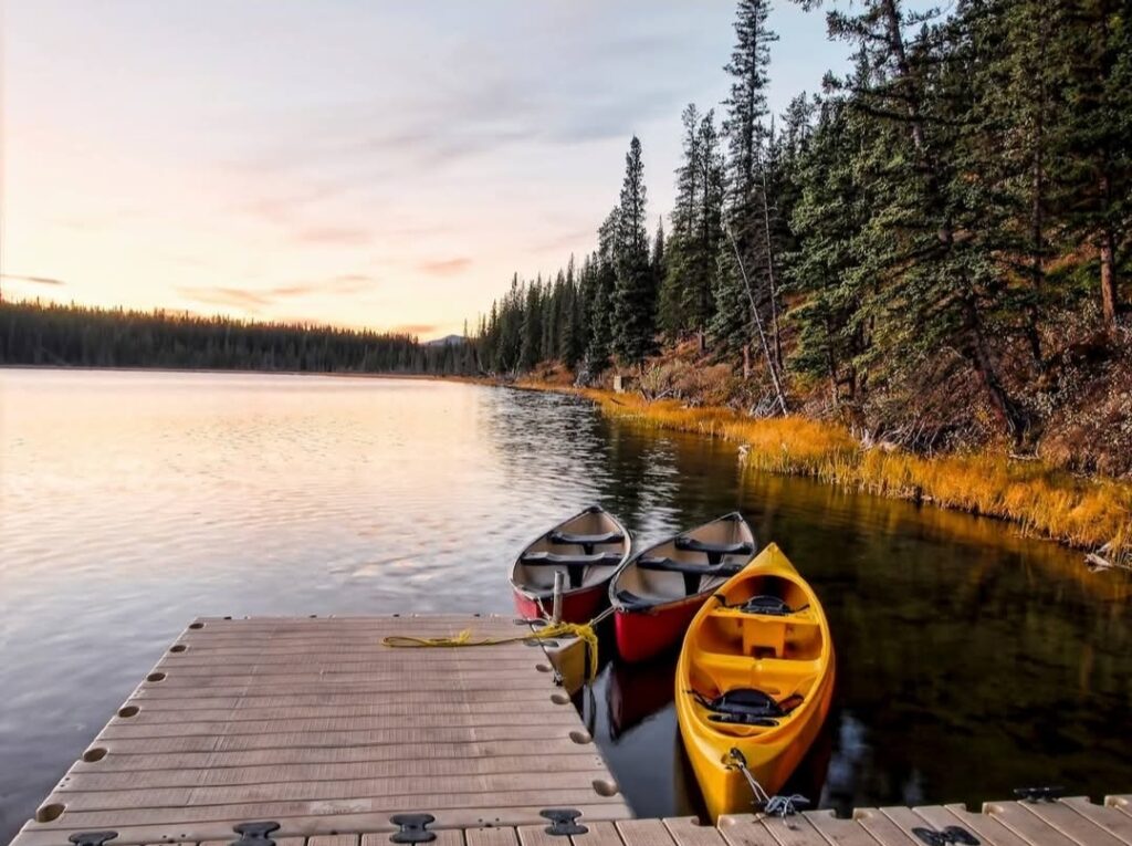 Canoes next to a lakeside dock